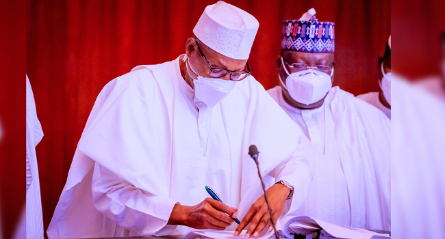 Buhari Signs Money Laundering, Terrorism Bills Into Law Buhari Signs Money Laundering, Terrorism Bills Into Law