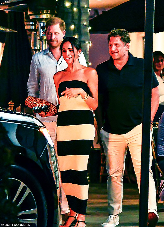 What crisis? Meghan Markle and Prince Harry step out