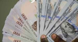 Naira exchanges at 980/dollar Naira exchanges at 980/dollar