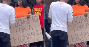 Lady hits the road with ”Looking For A Husband” placard Lady hits the road with ''Looking For A Husband'' placard