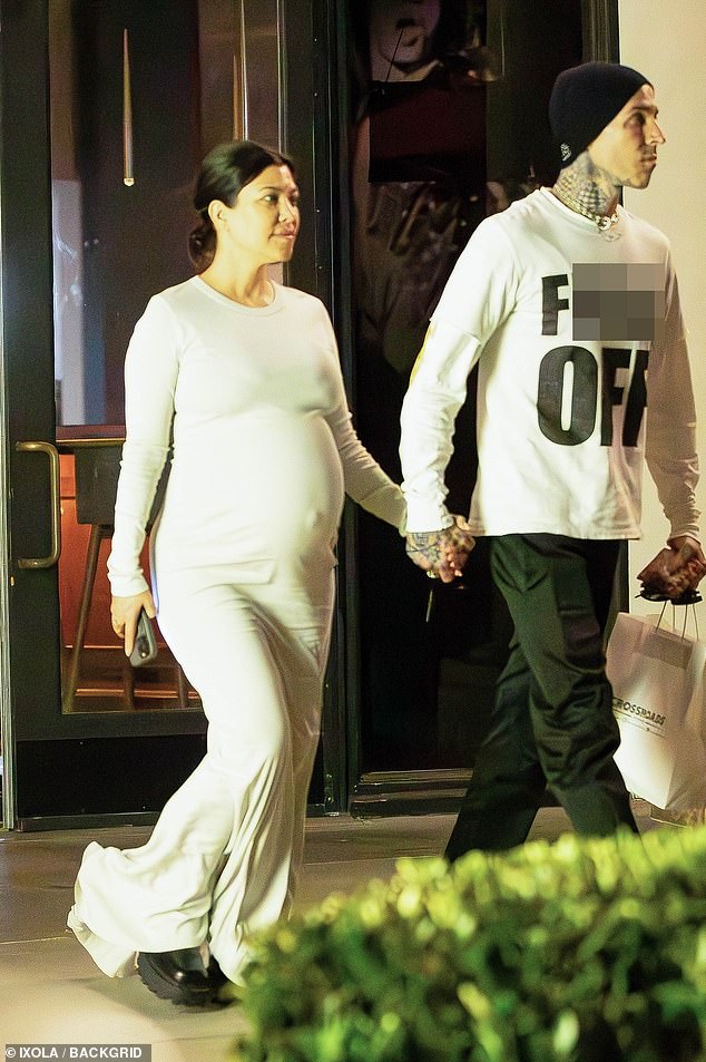 Kourtney Kardashian displays her HUGE baby bump as she steps out with husband