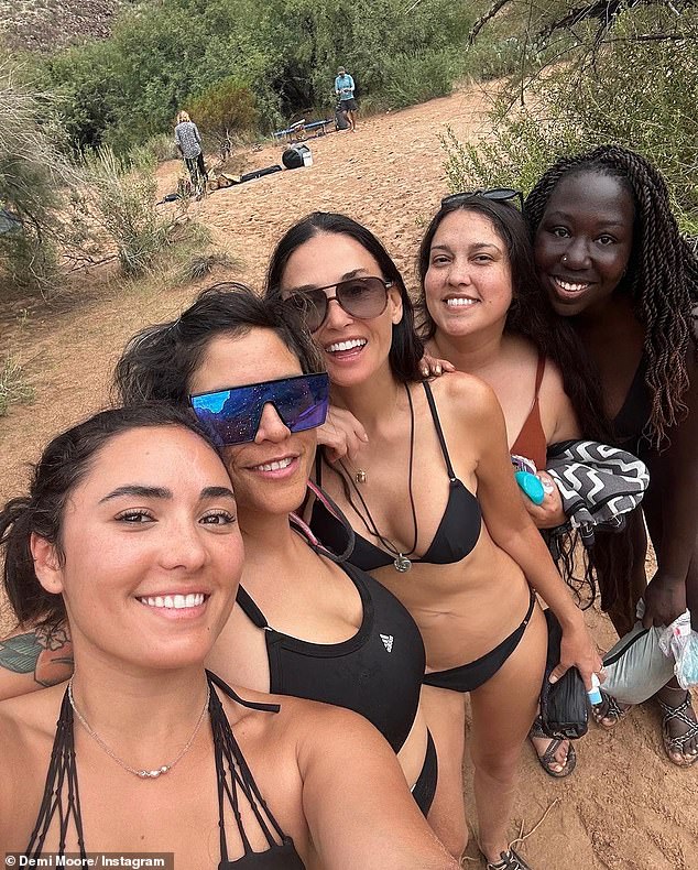Demi Moore, 60, bares her washboard abs in a bikini 