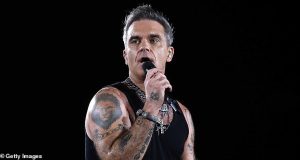 Robbie Williams fan dies after getting severe head injuries from horror fall at gig Robbie Williams fan dies after getting severe head injuries from horror fall at gig