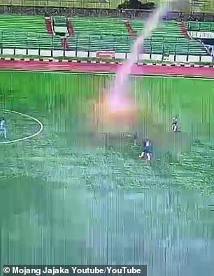 Terrifying moment footballer is struck by lightning during a match