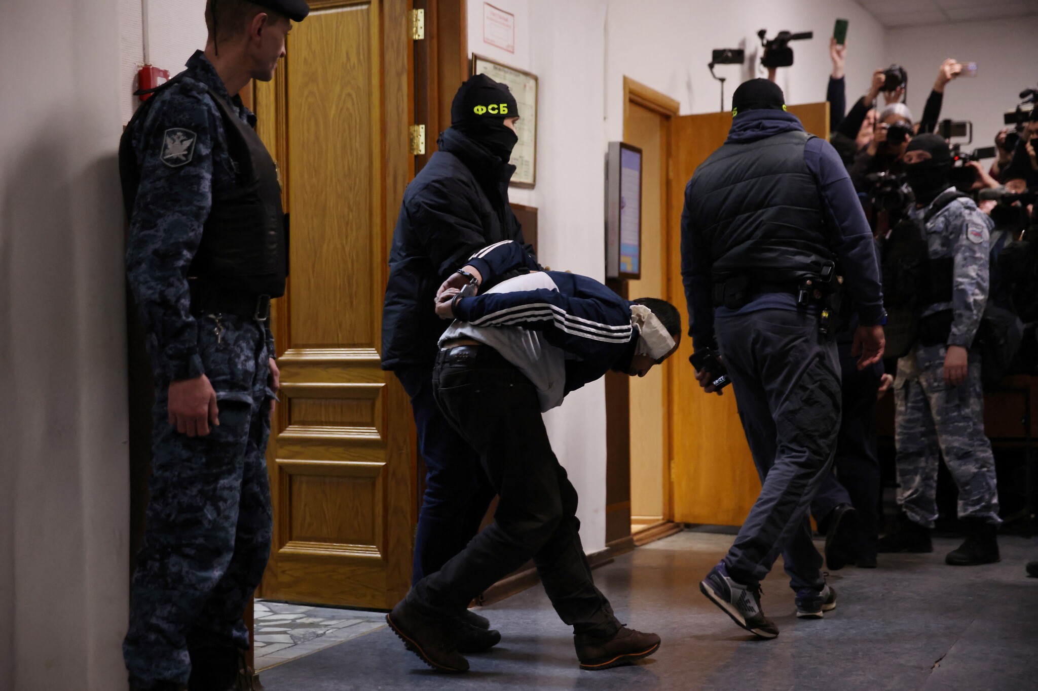 4 suspects in Moscow concert hall attack have faced trial in a Russian court