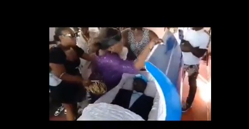 Moment wife ad side chic exchanged blows at man's funeral <p data-wpview-marker=