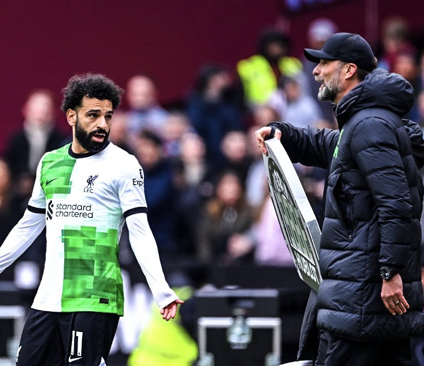 Jurgen Klopp and Mohammed Salah engage in a heated argument on the touchline