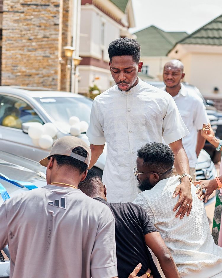 Moses Bliss gifts some of his associates three new cars