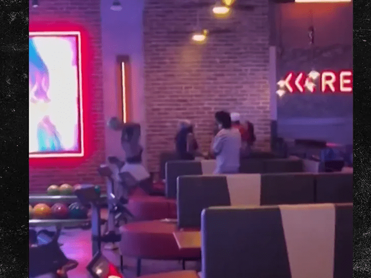 Woman throws bowling ball in fight