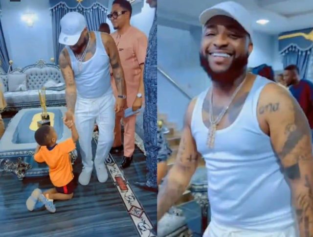 Fans gush as little boy goes on both knees to greet Davido