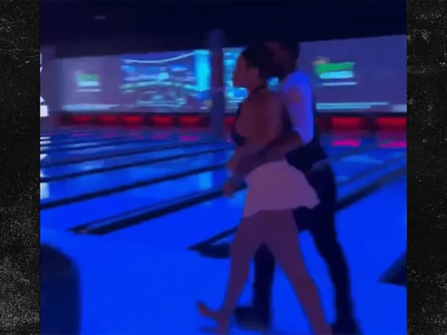 Woman throws bowling ball in fight