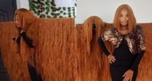 Nigerian Lady breaks Guinness World Record for the Widest Wig in the World Nigerian Lady breaks Guinness World Record for the Widest Wig in the World