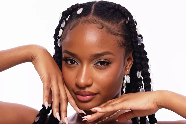 Ayra Starr cozies up with man at her live performance 