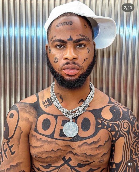 Trinity Guy extremely tattoos Davido's name on his body