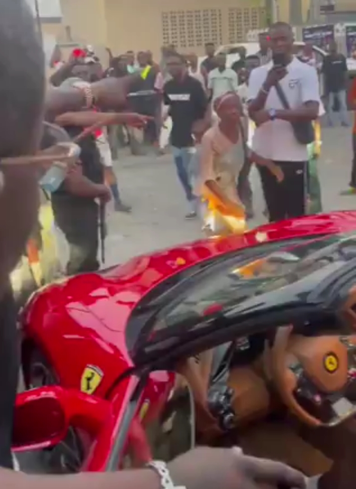Burna Boy surprises nursing mum with wads of cash