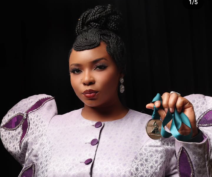 Yemi Alade shows off her Grammy Nominee Medal Yemi Alade shows off her Grammy Nominee Medal