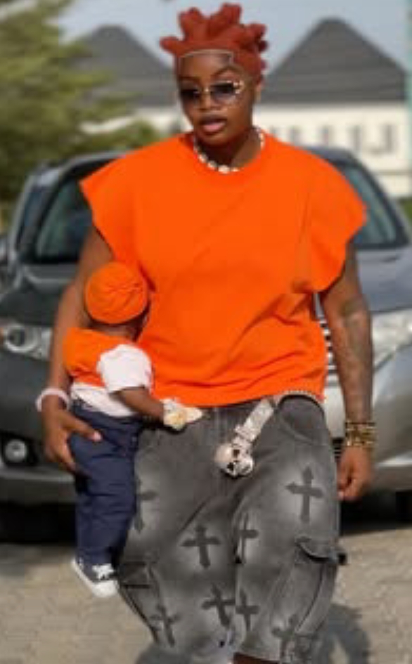 Black Chully receives backlash for holding baby in a strange manner