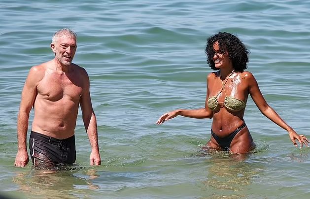 Vincent Cassel, 58, frolics on the beach with his model-wife who is 30 years YOUNGER