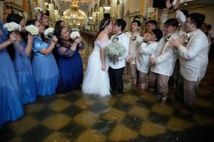 Couple ties knot in FLOODED church
