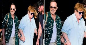 Elton John holds hands with husband as they depart £23m yacht Elton John and husband David Furnish
