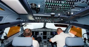 Pilot suspended after ‘leaving cockpit door open’ Pilot suspended after 'leaving cockpit door open'