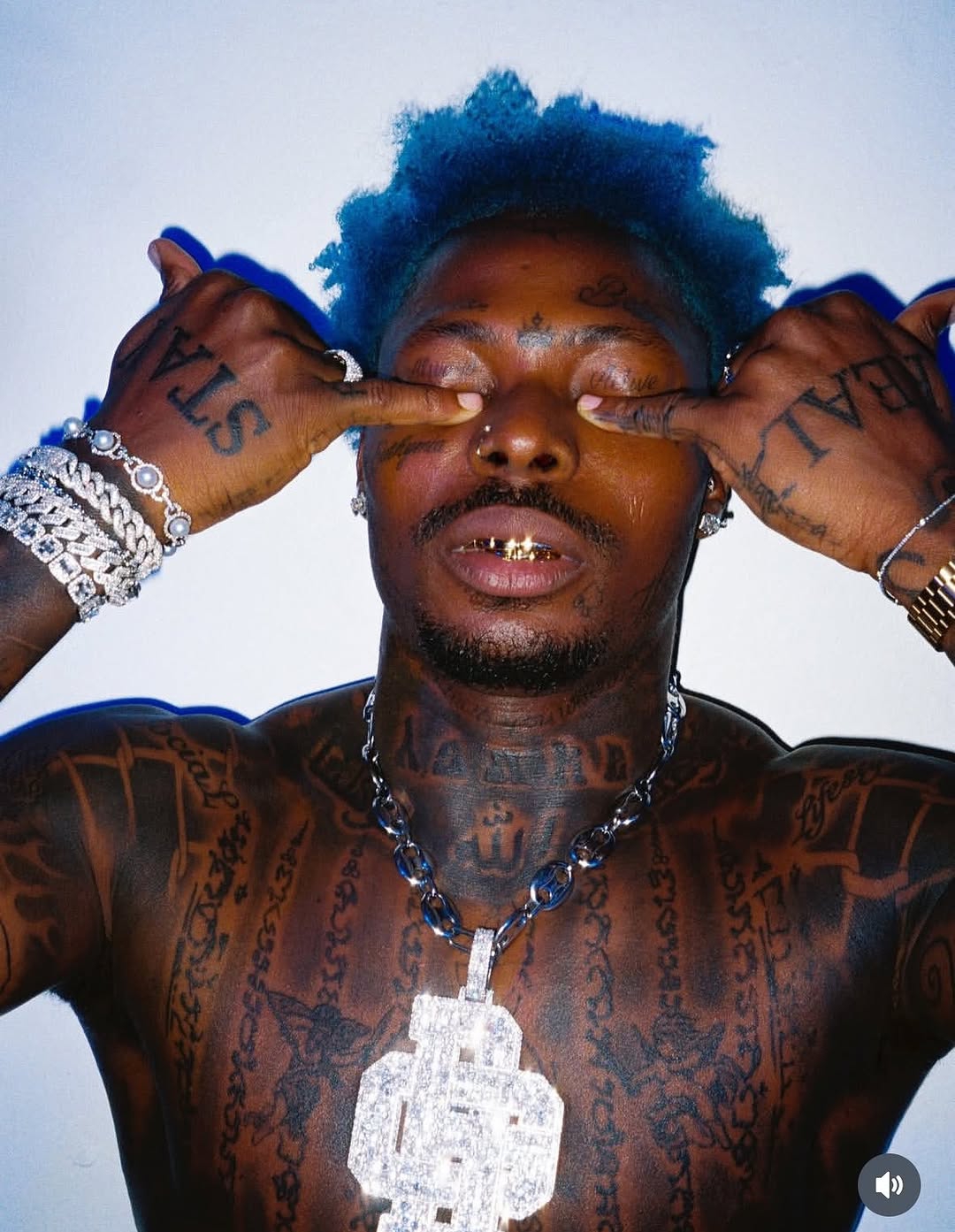 Asake flaunts extensive tattoos and muscle