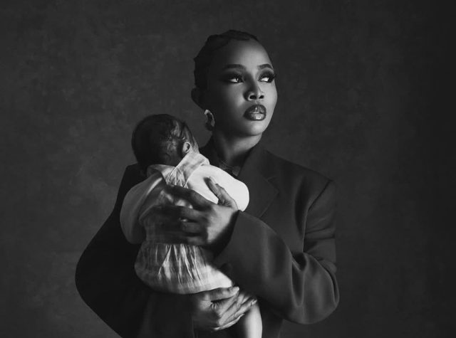 Toke dedicates baby at church