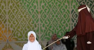 Indonesia couple caned 140 times for s3x outside marriage Indonesia couple caned 140 times for s3x outside marriage