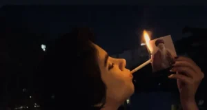 Iranian women light cigarettes with burning photo of supreme leader Iranian women light cigarettes with burning photo of supreme leader