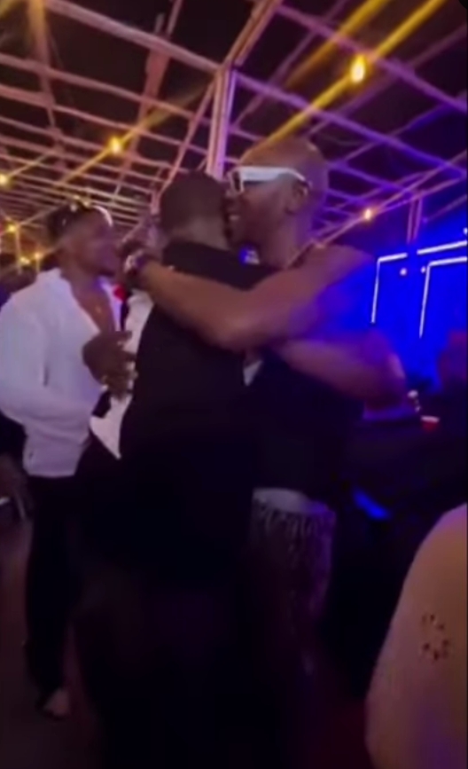 Seun Kuti and DJ Tunez hug at the club after Wizkid-Fela drama