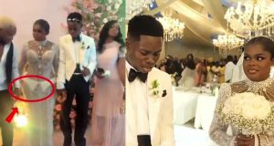 Man causes stir after holding Jarvis hand at her white wedding Man causes stir after holding Jarvis hand at her white wedding