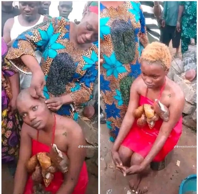 Woman undergoes traditional cleansing after recording Oloolu procession